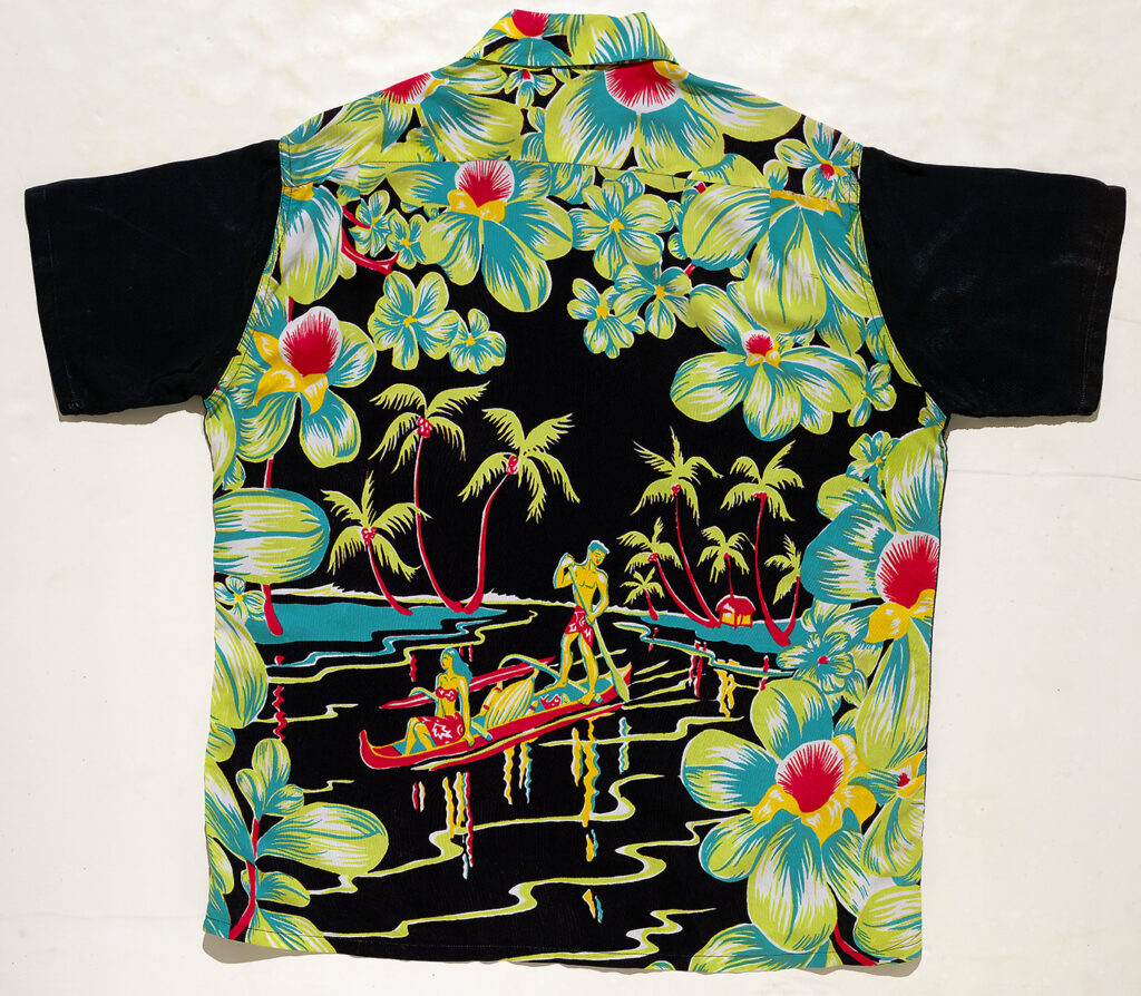 Aloha shirt (back) depicting Polynesians boating a lagoon